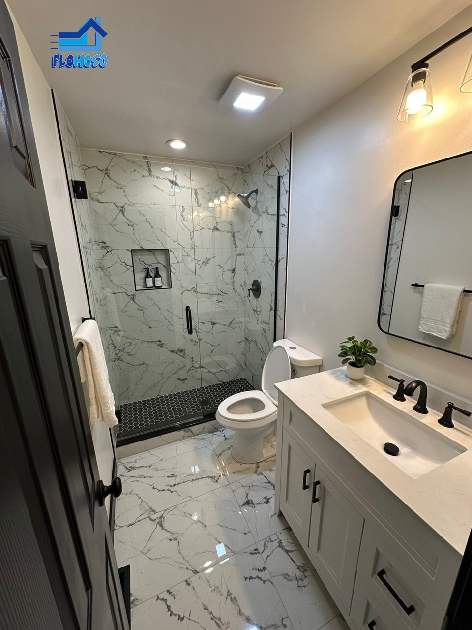Bathroom remodel with white tile shower and modern vanity