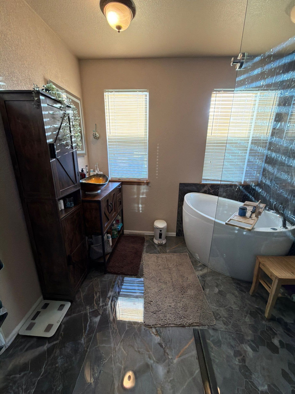Bathroom remodel with dark tile shower and soaking tub near Denver Colorado