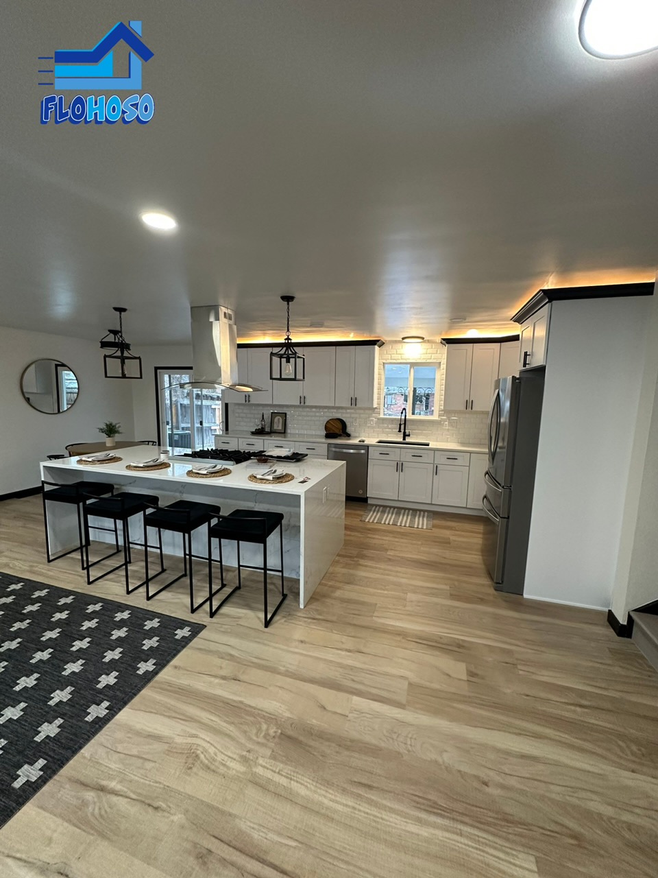 Luxury vinyl plank flooring in open concept kitchen and living room