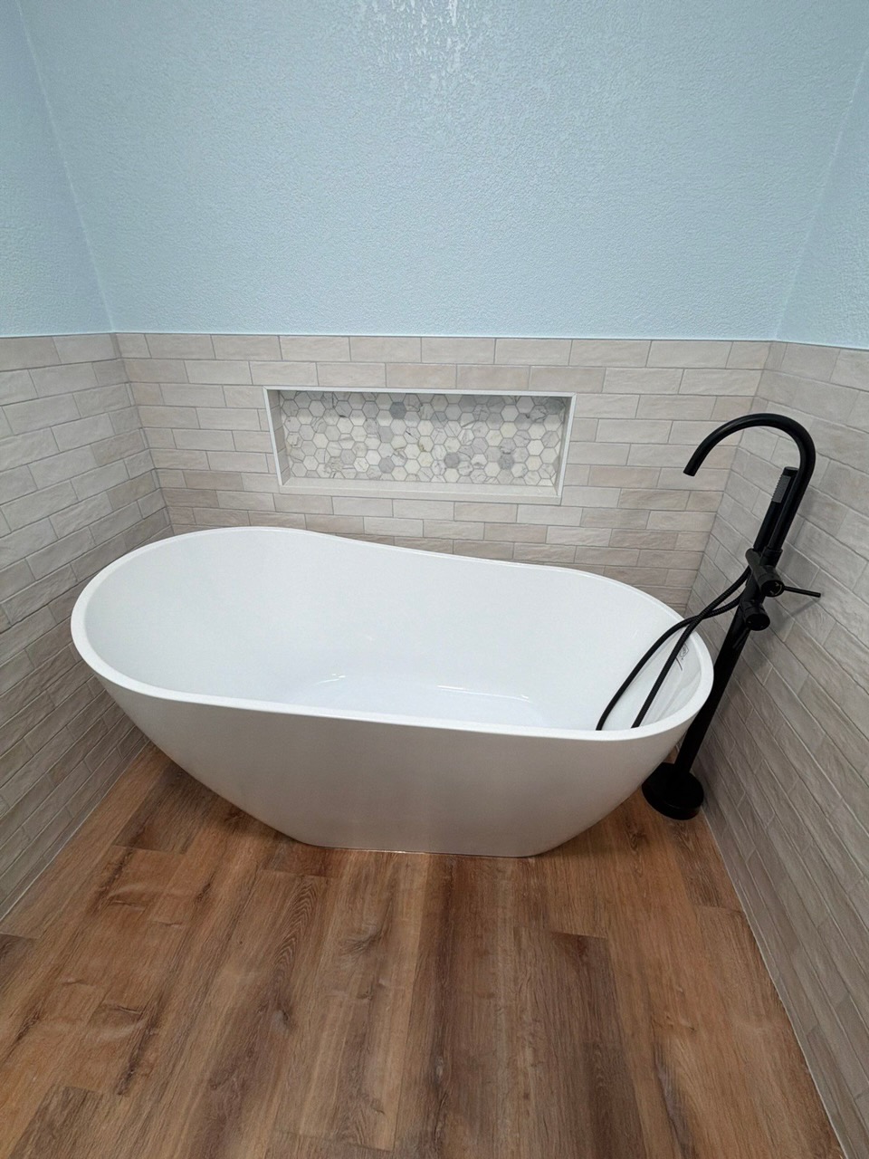 Freestanding tub and bathroom tile remodel